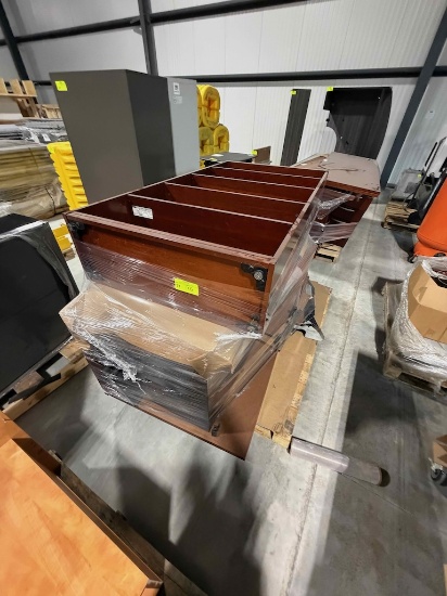 Pallets of wooden office furniture