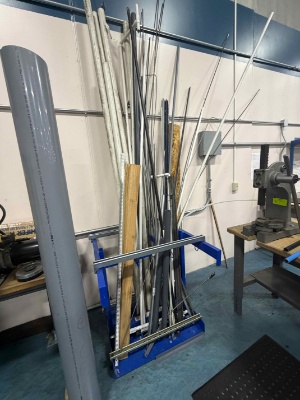 Rack with misc pipe, threaded rod, angle iron, etc