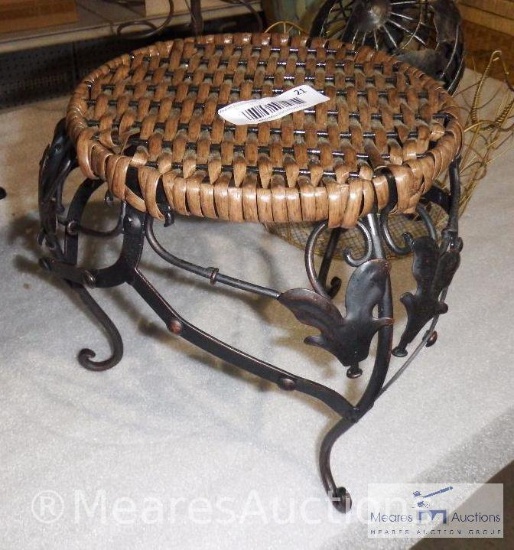 Ornate metal stool with woven seat