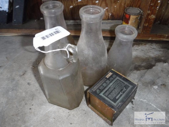 Zebco reel in original box and vintage milk bottles
