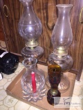 Lot of oil lamps & a candle globe