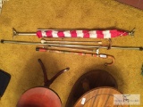 Lot of flag and flag pole, grabber, curtain rod, and walking canes