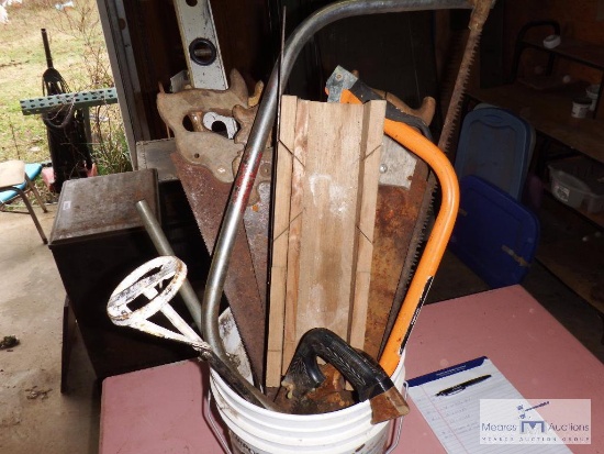 Bucket full of hand tools and hardware items