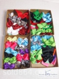 Four boxes of hair bows