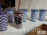 Plastic cups with plastic lid and straws