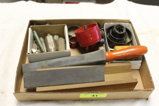 Box of Hole Saws, Plumb Bobs and Sharpening Stones.