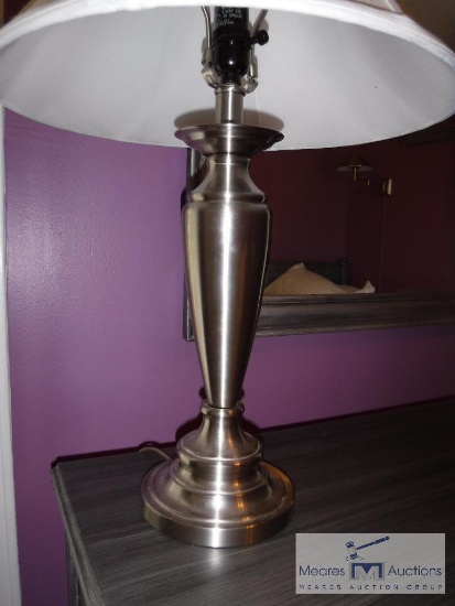 Silver-colored lamp with shade