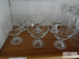 Shelf of clear drinkware - sherbets, sundae glasses - cake plate