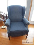 Blue upholstered chair with footrest