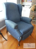Blue upholstered chair with footrest
