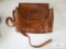 Beautiful vintage leather shoulder bag with photo equipment