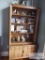 Wooden bookcase with lower storage doors