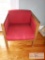 Red cushioned chair - light wooden rails