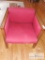 Red cushioned chair - light wooden rails