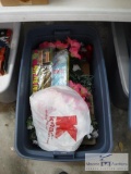 Plastic tote of floral decorations