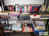 Two shelves of mixed fiction and nonfiction books