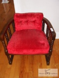 Red cushioned chair - dark wooden rails