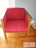 Red cushioned chair - light wooden rails