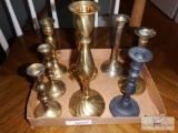 Group of brass candle holders and decorative items