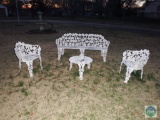 Four pieces of cast iron lawn furniture