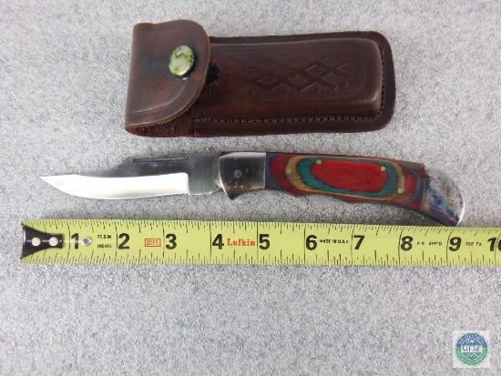 Folding pocket knife with belt sheath