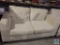 Cream colored love seat