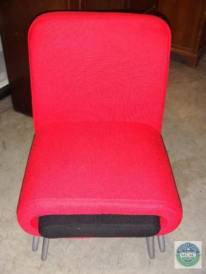 Red cloth covered chair with ottoman