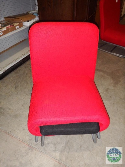Red cloth covered chair with ottoman