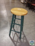 Green stool with natural seat