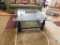 Wooden framed coffee table with glass top