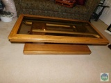 Wooden coffee table with glass top