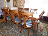 Wooden dining table with leaf and 8 chairs