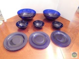 Eight pieces of decorative blue glass service items