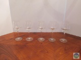 Five clear glass drink stems