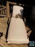 Outdoor lounger with cushion