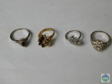 Lot of 4 plated rings with synthetic stones