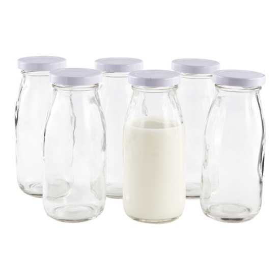 Large collection of dairy, farm and milk bottles