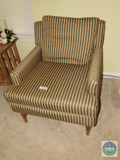 Green and gold upholstered chair with wooden base