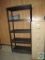Black plastic shelf and four-drawer file cabinet