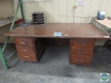 Wooden office desk with filing baskets