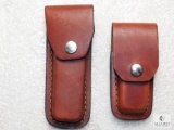 2 leather cases for folders one with 3