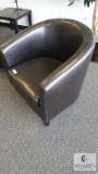 Brown padded barrel chair (ottoman not included)