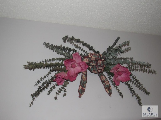 Wall contents of dining room wall candle scroll sconces and floral decor