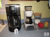 Counter lot includes 2 mr. Coffee makers salt and pepper shaker and glass cutting board