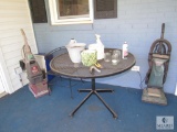 Contents of back porch metal chair and table and two vacuums