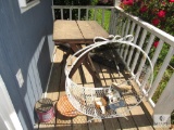 Storage building porch contents firewood Rack and wooden table