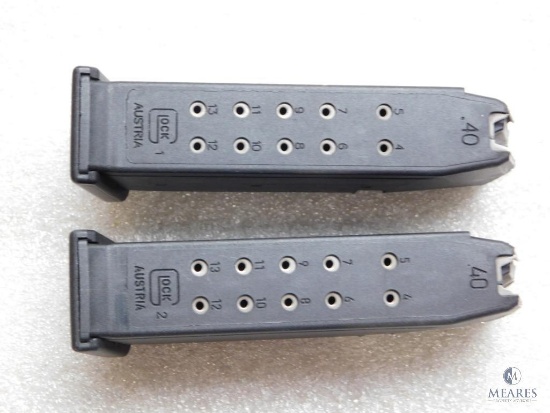 2 Factory Glock .40 S&W magazines each hold 13 rounds of ammo