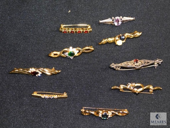 Assorted costume bar pins