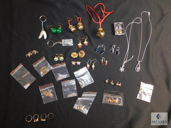 Assorted costume jewelry includes matched earrings, christmas items, etc.