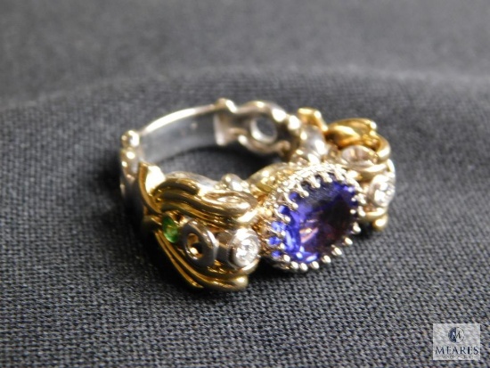 Ornate ring set with purple stone , Approximate size 8